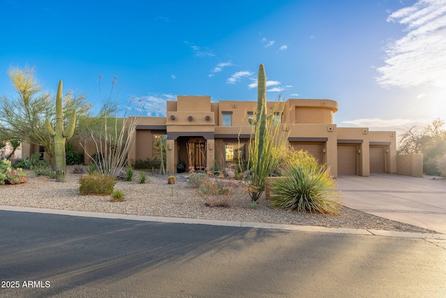 southwest-style home with stucco siding and driveway