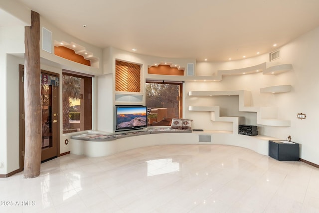 unfurnished living room featuring visible vents and recessed lighting