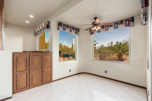 spare room featuring recessed lighting, baseboards, light floors, and ceiling fan