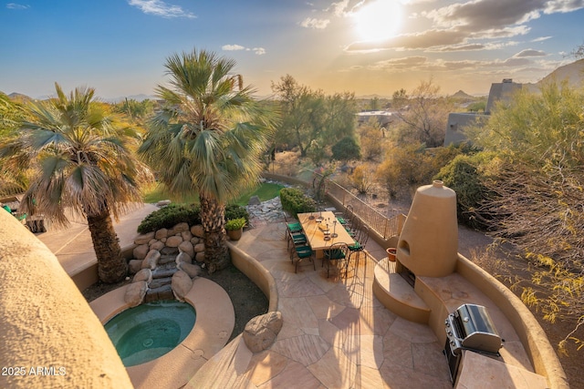 view of swimming pool with outdoor dining area, an in ground hot tub, and a patio area