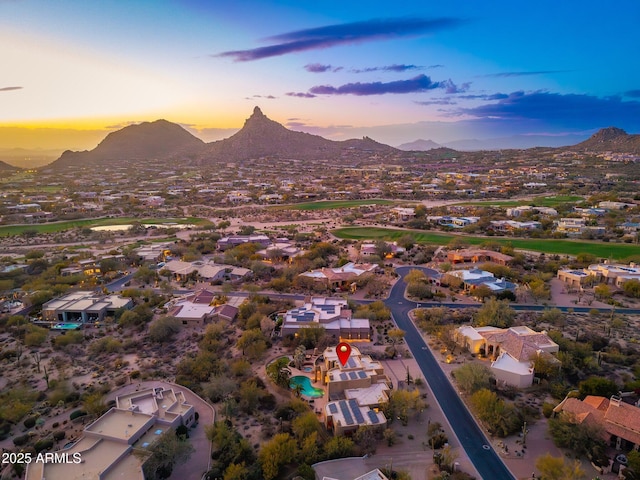 aerial view at dusk with a mountain view