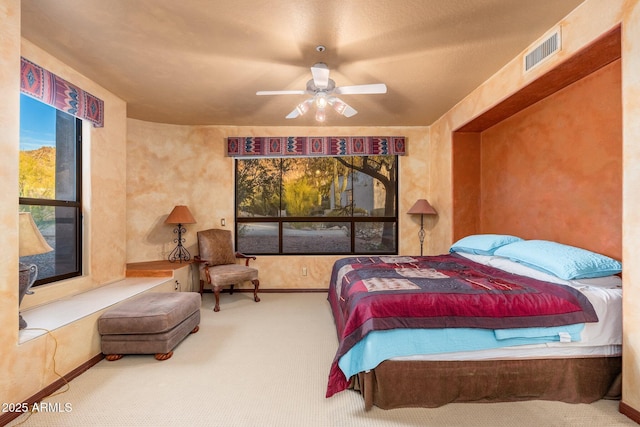 bedroom featuring visible vents, ceiling fan, baseboards, and carpet floors