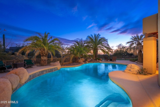 view of swimming pool with a fenced in pool, a patio, and fence