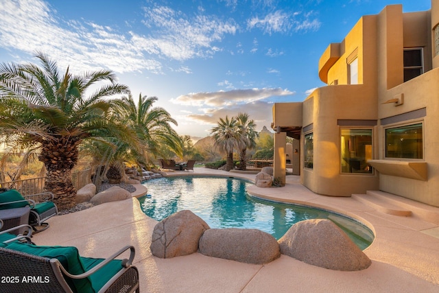 outdoor pool with a patio