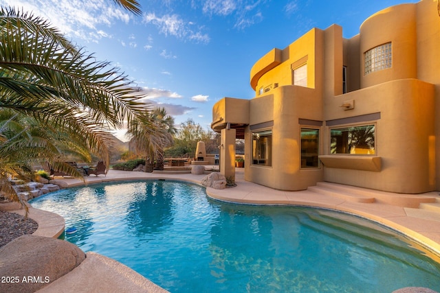 outdoor pool with a patio