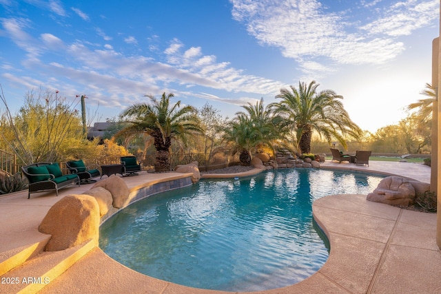 view of swimming pool featuring a fenced in pool and a patio area