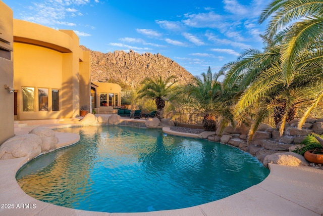 view of swimming pool featuring a patio area and a fenced in pool