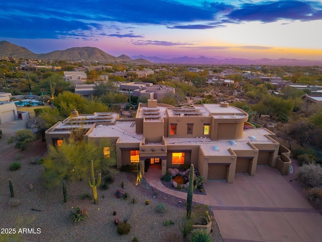 birds eye view of property featuring a mountain view