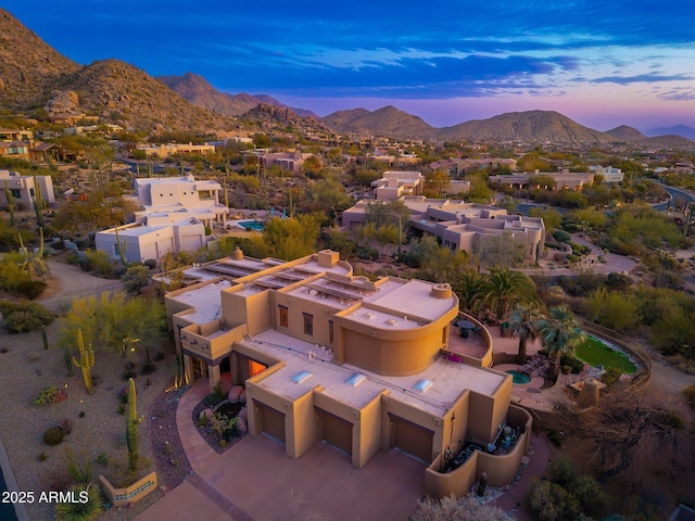 aerial view at dusk with a mountain view