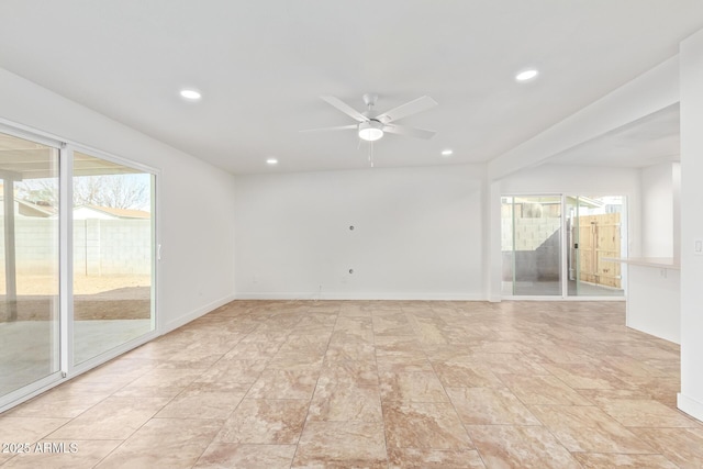 spare room with ceiling fan