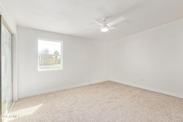 unfurnished room with light carpet and ceiling fan