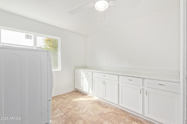 interior space with washer / clothes dryer and ceiling fan