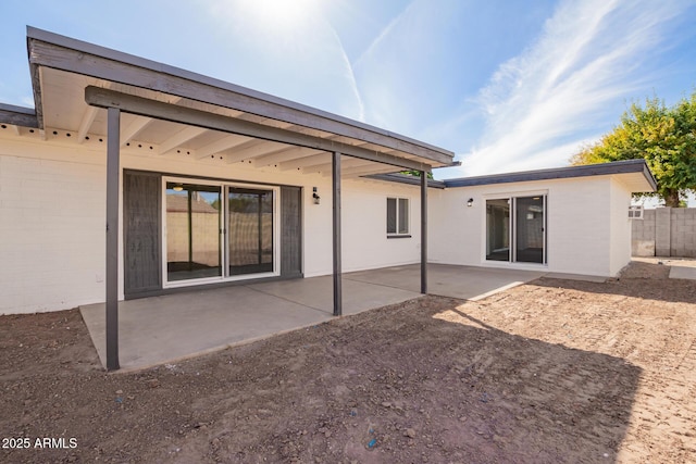 rear view of property featuring a patio area