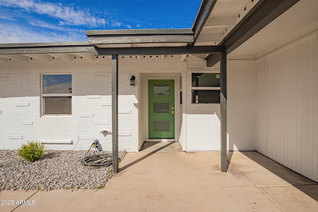 doorway to property featuring a patio area