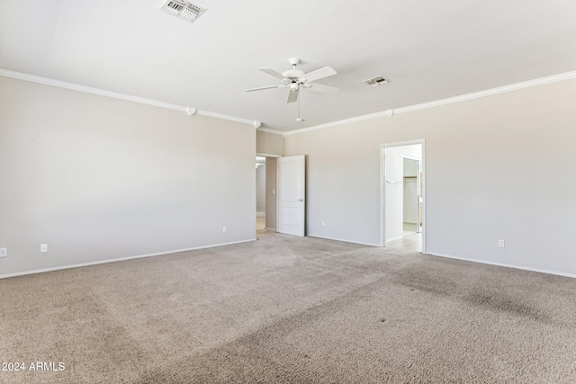 carpeted empty room with crown molding and ceiling fan