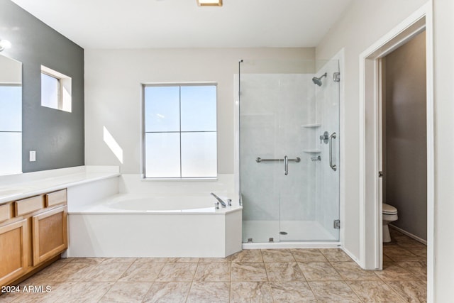 full bathroom with toilet, vanity, tile patterned floors, and separate shower and tub