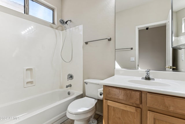 full bathroom featuring toilet, vanity, and tub / shower combination