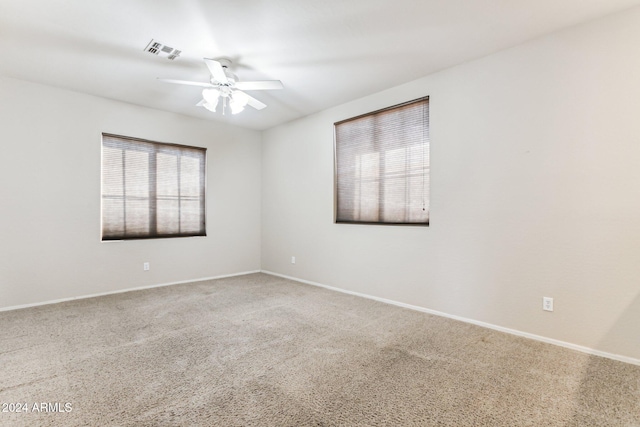 empty room with carpet and ceiling fan