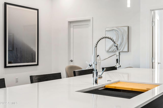 interior space featuring a sink and light countertops