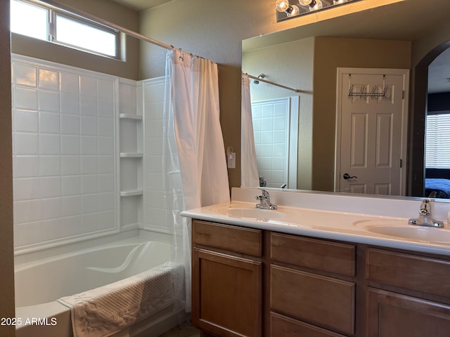 bathroom featuring vanity and shower / bath combination with curtain