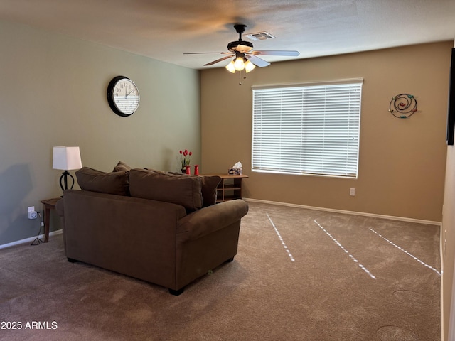 living room featuring ceiling fan and carpet floors