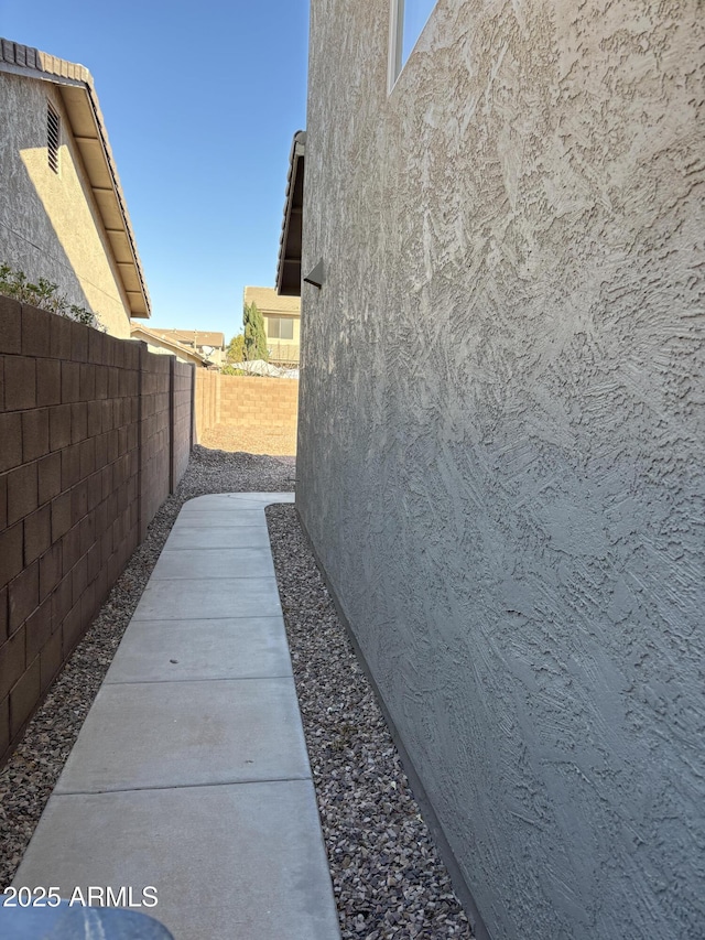 view of property exterior featuring a patio area