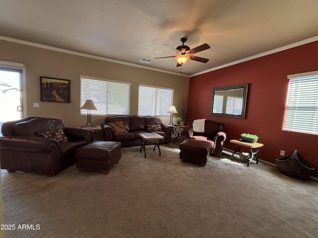 carpeted living room with ceiling fan and ornamental molding