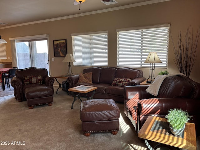 carpeted living room with ceiling fan and crown molding