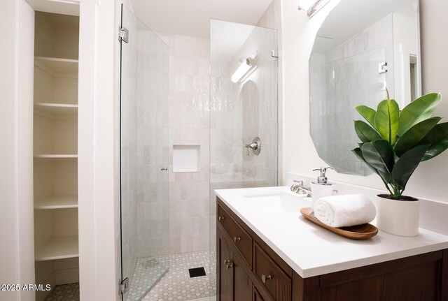 7348 N 9th Pl, Phoenix, AZ 85020 - bathroom featuring a shower stall, vanity, a walk in closet, and tile patterned flooring