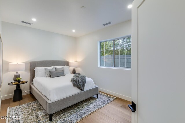 7348 N 9th Pl, Phoenix, AZ 85020 - bedroom featuring wood finished floors, recessed lighting, and baseboards