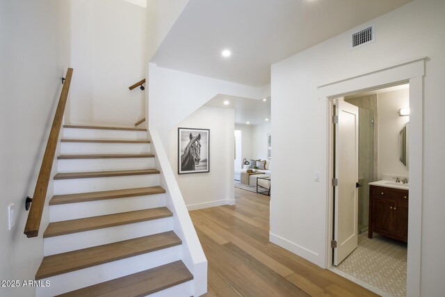 7348 N 9th Pl, Phoenix, AZ 85020 - stairway with wood finished floors, baseboards, and recessed lighting