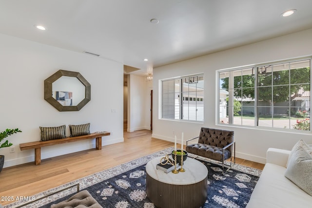 7348 N 9th Pl, Phoenix, AZ 85020 - living area with healthy amount of natural light, wood finished floors, recessed lighting, and baseboards