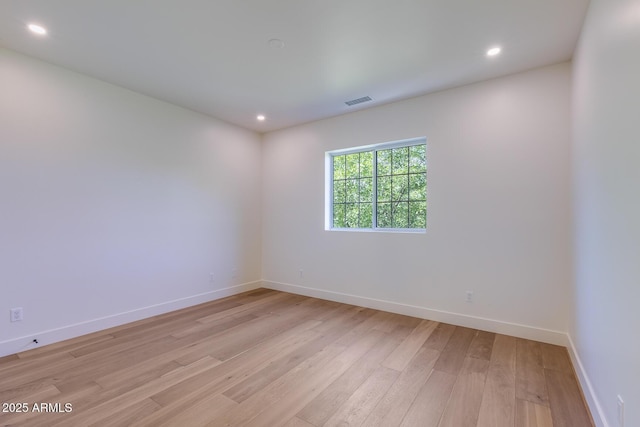 7348 N 9th Pl, Phoenix, AZ 85020 - unfurnished room featuring light wood-type flooring, baseboards, and recessed lighting