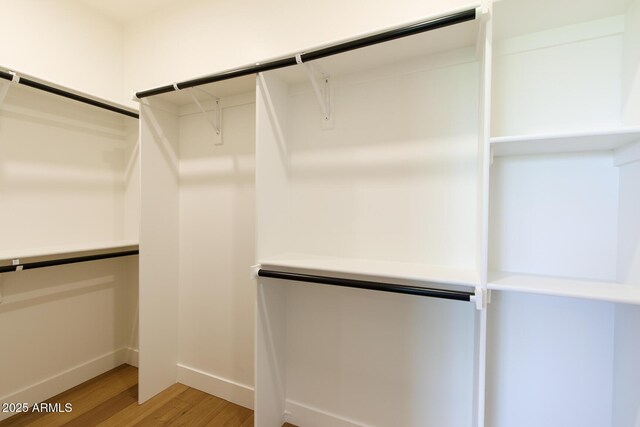 7348 N 9th Pl, Phoenix, AZ 85020 - walk in closet featuring light wood-style floors