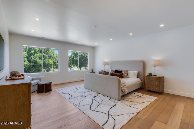 7348 N 9th Pl, Phoenix, AZ 85020 - bedroom with multiple windows, light wood finished floors, recessed lighting, and baseboards