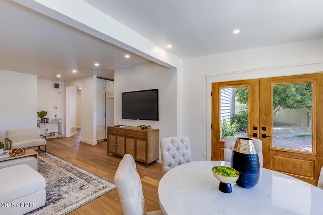 7348 N 9th Pl, Phoenix, AZ 85020 - dining space featuring light wood finished floors, recessed lighting, and french doors