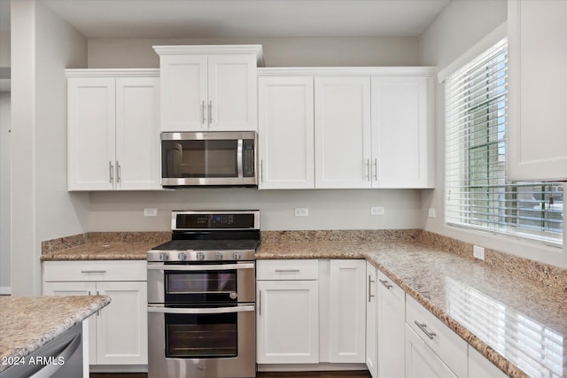 10630 W Pinchot Ave, Avondale, AZ 85392 - kitchen with white cabinetry, appliances with stainless steel finishes, and light stone countertops