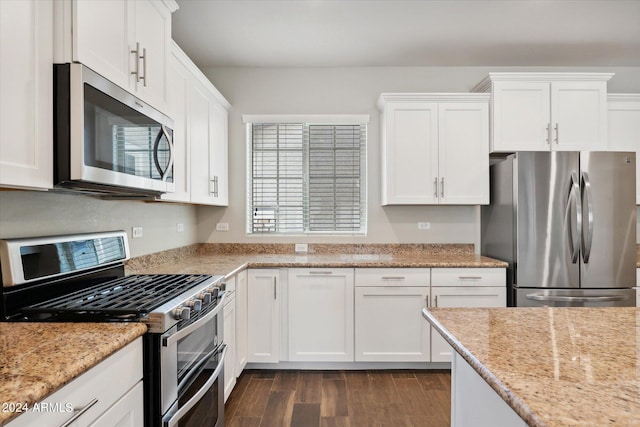10630 W Pinchot Ave, Avondale, AZ 85392 - kitchen with stainless steel appliances, dark wood-type flooring, white cabinets, and light stone counters