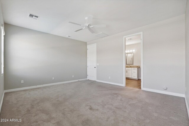 10630 W Pinchot Ave, Avondale, AZ 85392 - unfurnished bedroom with ceiling fan, light colored carpet, and connected bathroom