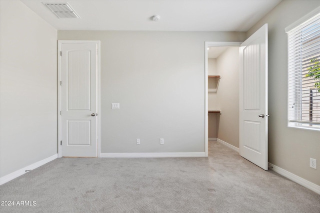 10630 W Pinchot Ave, Avondale, AZ 85392 - unfurnished bedroom with light colored carpet and a walk in closet