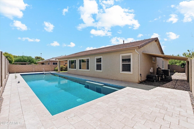 10630 W Pinchot Ave, Avondale, AZ 85392 - view of swimming pool featuring central air condition unit and a patio area