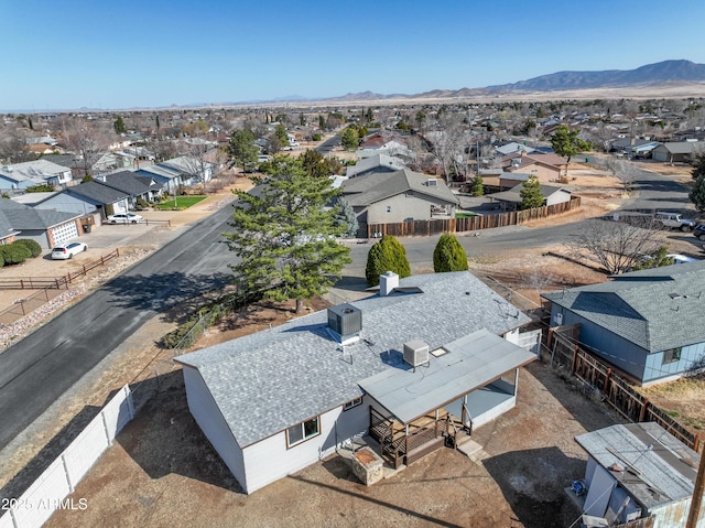 birds eye view of property featuring a mountain view and a residential view