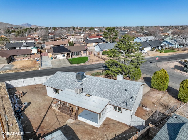 drone / aerial view featuring a mountain view and a residential view