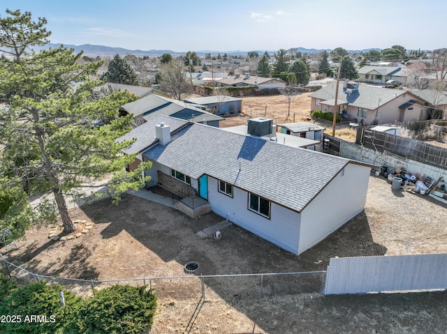 birds eye view of property featuring a mountain view and a residential view