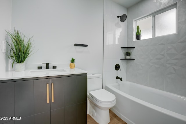 full bathroom with wood finished floors, toilet, vanity, and bathing tub / shower combination