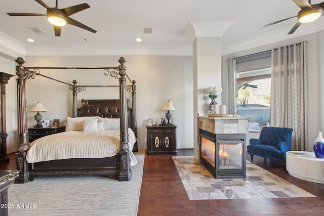 bedroom with recessed lighting, wood finished floors, and a ceiling fan