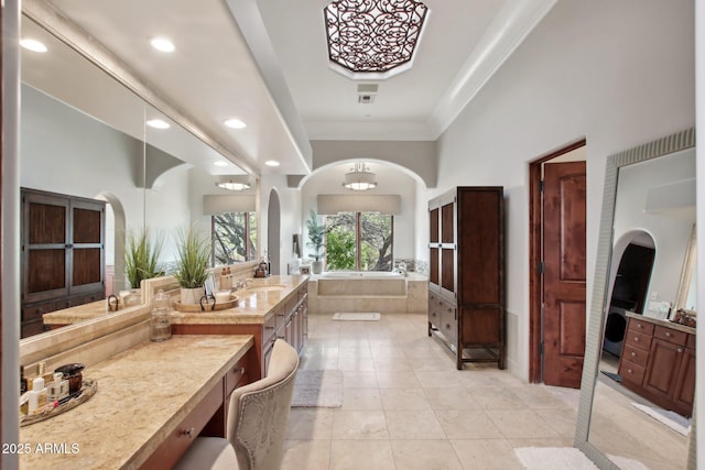 full bath with tile patterned floors, recessed lighting, crown molding, a bath, and vanity