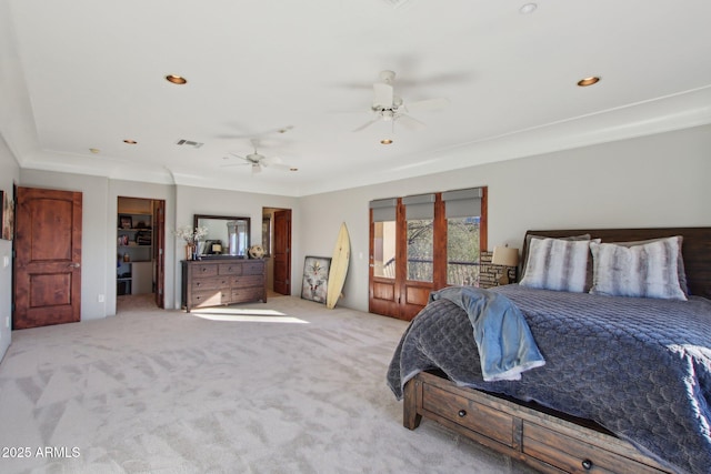 carpeted bedroom featuring a walk in closet, recessed lighting, a ceiling fan, and visible vents