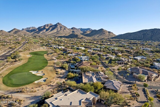 bird's eye view featuring a mountain view and view of golf course