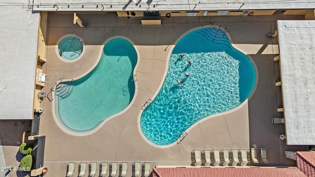 view of swimming pool with a patio area